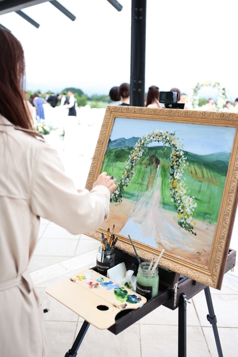 披露宴の最中にリアルタイムで描き上げます