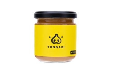 豚ニンニク系のラーメンの味をモチーフにした ニンニクマシマシ万能調味料「TONGARI」が先行販売開始！ 日本初！？マルハン新宿東宝ビル店エスカレーターから販売