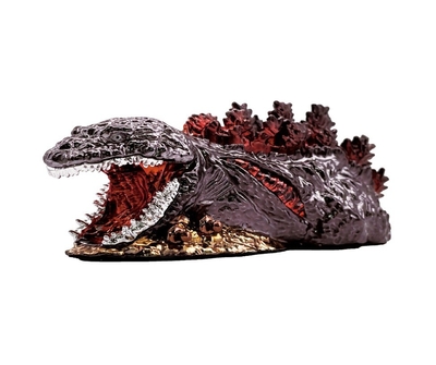 ▲オリジナルゴジラ金属フィギュア（長さ13cm、横幅5.5cm）