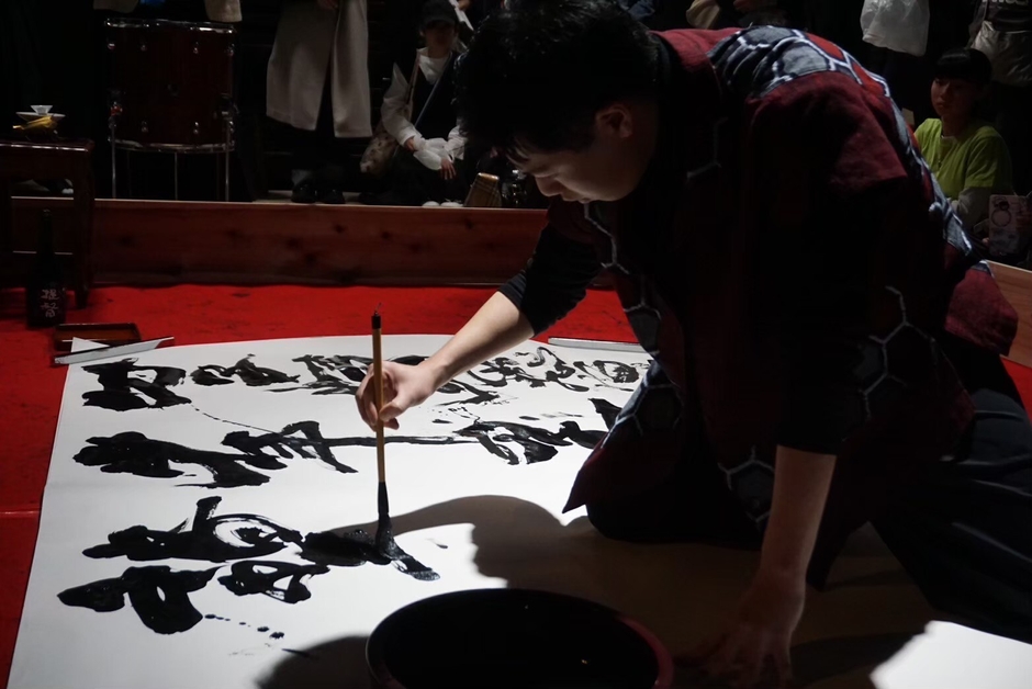 生徒代表席上揮毫