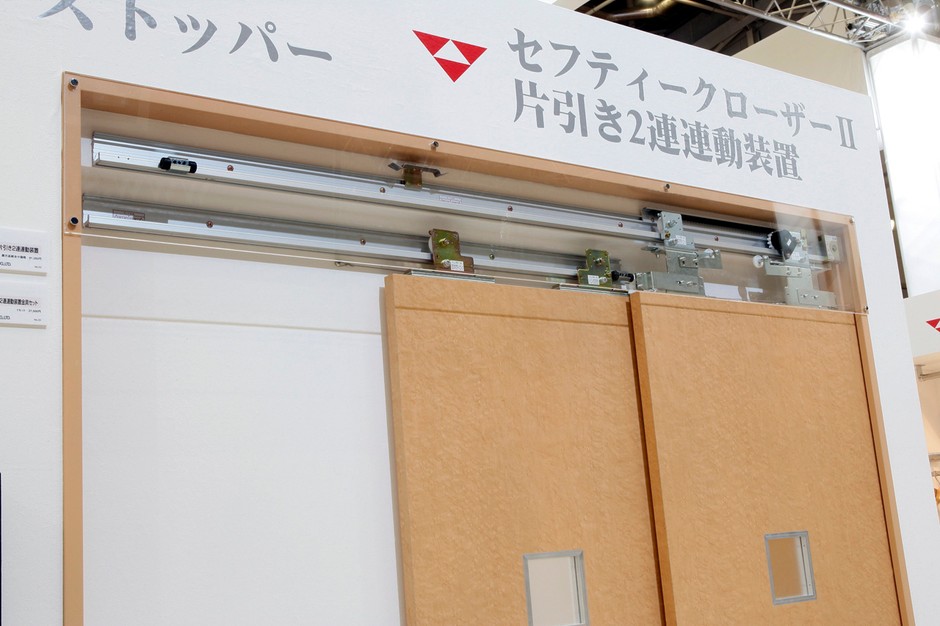 片引き2連連動装置