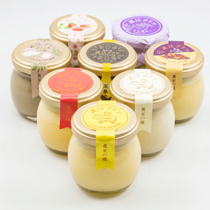 農家の嫁 近江プリン 上段から左:いちご/右:こしあん/上段2列目左:ほうじ茶山椒/中:チョコレート/右:ラムレーズン/上段3列目左:リッチ/右:ライス/下:プレーン