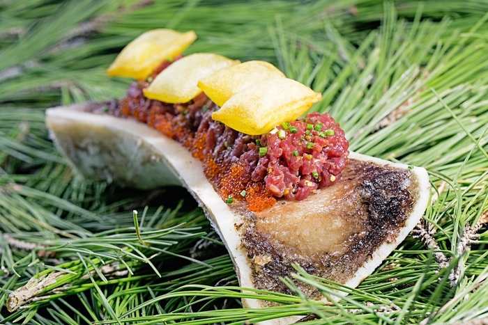 Antonio Romero Steak Tartare over grilled bone marrow